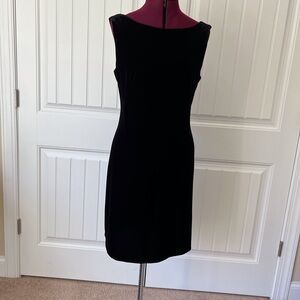 Black velvet dress with lace insert with draped back.
